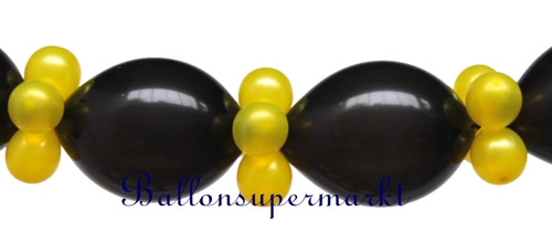 Girlande aus schwarzen und goldenen Luftballons