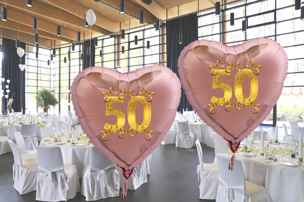 Goldene-Hochzeit-Herzluftballons-aus-Folie-roseegold-50-mit-goldenen-Schleifen