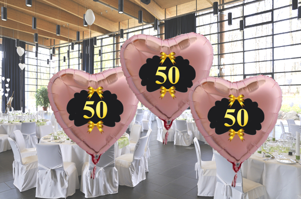Goldene-Hochzeit-Herzluftballons-aus-Folie-roseegold-mit-goldenen-Schleifen
