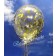 Großer Konfetti-Ballon mir goldenem Glitzerkonfetti gefüllt