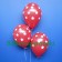 Luftballons zu Silvester und Neujahr, rot mit Sternen